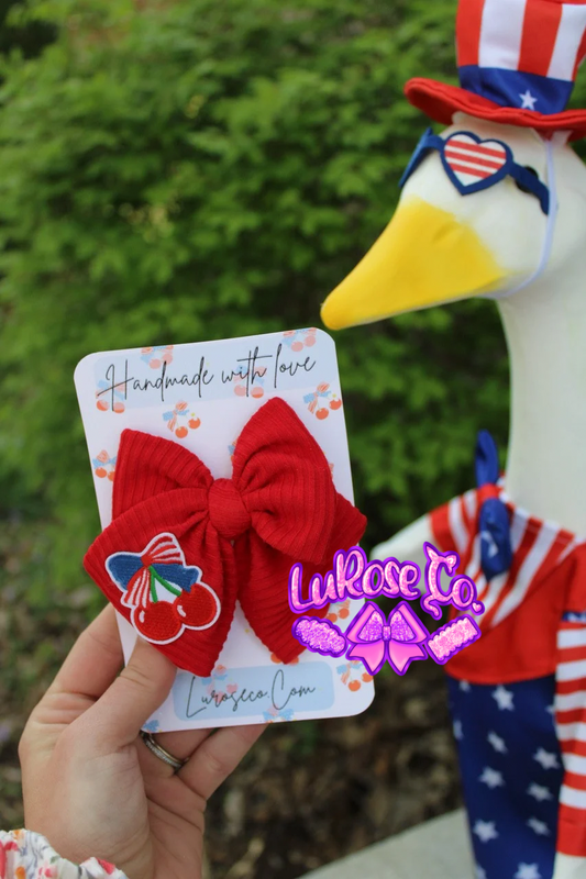 red handtied bow with cherries patch