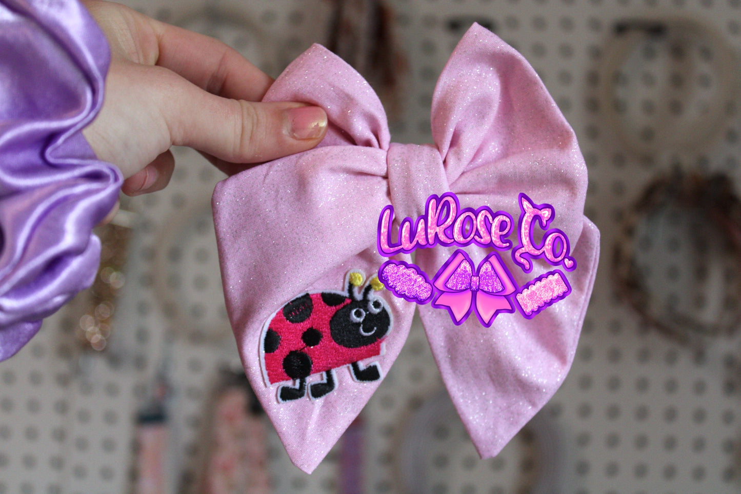 Glittery pink ladybug hand-tied (this is cotton fabric)